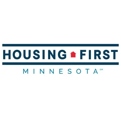 Housing First Minnesota logo featuring a small red house icon between the words HOUSING and FIRST with blue horizontal lines above and below and 'MINNESOTA' in blue beneath.